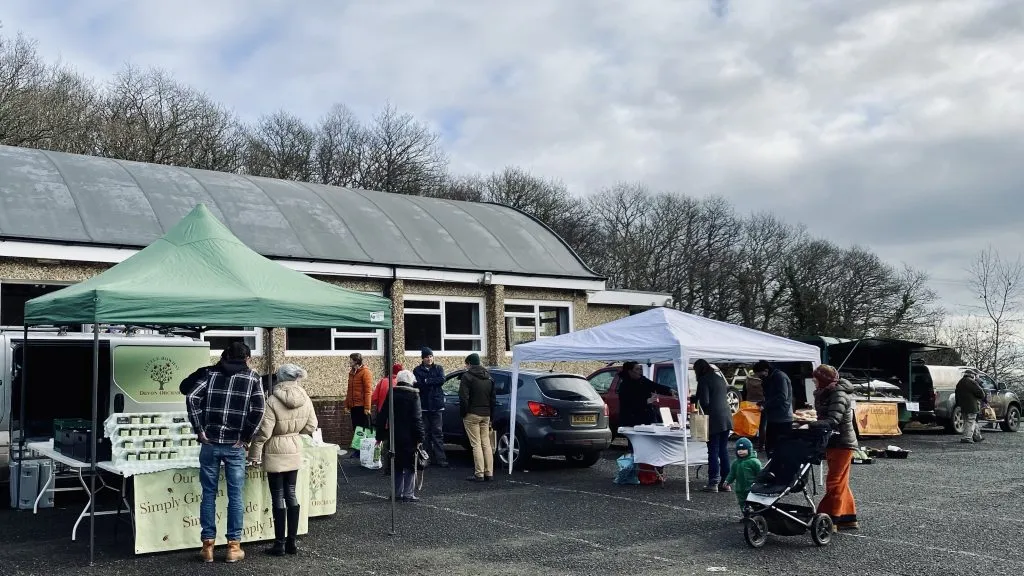 Farmers' market stalls set up outside Longdown Village Hall