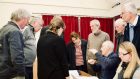 Parish councillors gathered around a desk