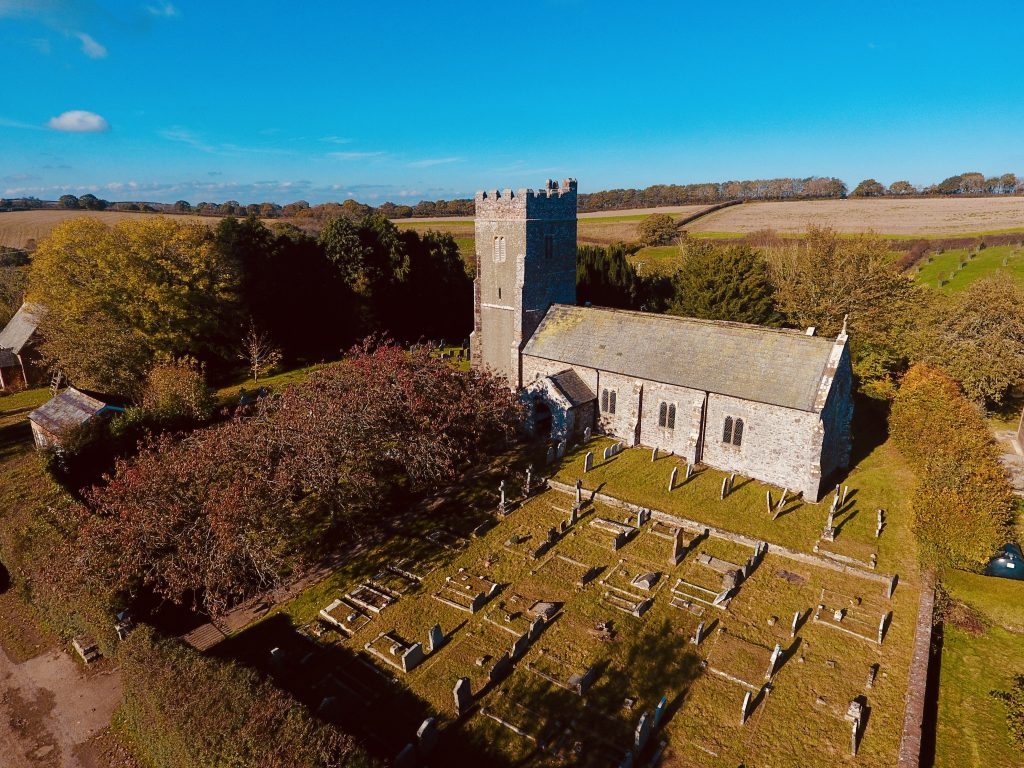 Holcombe Burnell Church from the air on a glorious summer day