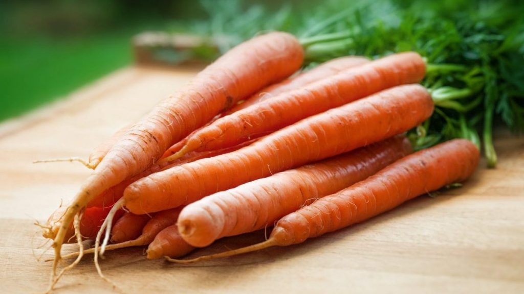 Fresh carrots on a chopping board